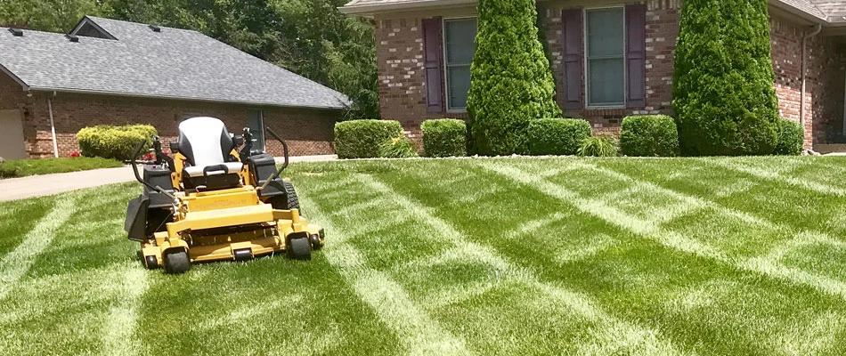 Our professional grade lawn mower sitting on a lawn in New Albany, IN.